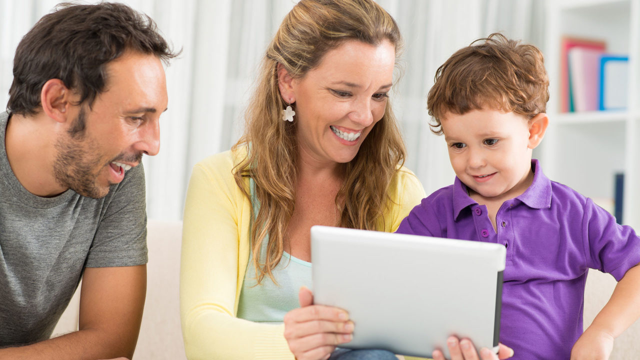 Parents and Toddler with iPad