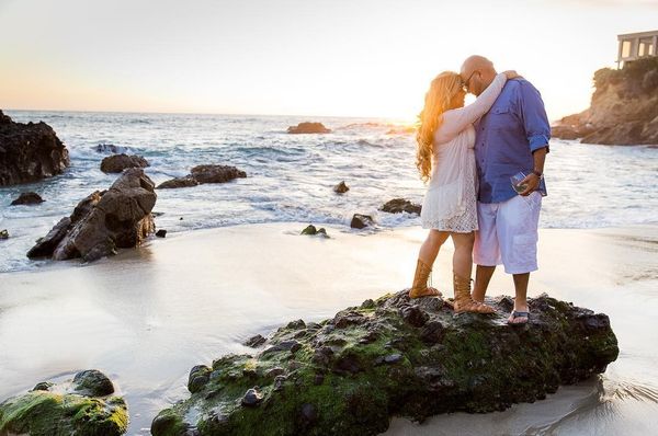 lovers on the rocky shore of the ocean