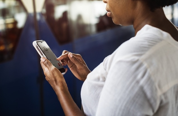 A woman using her iPhone to receive a call