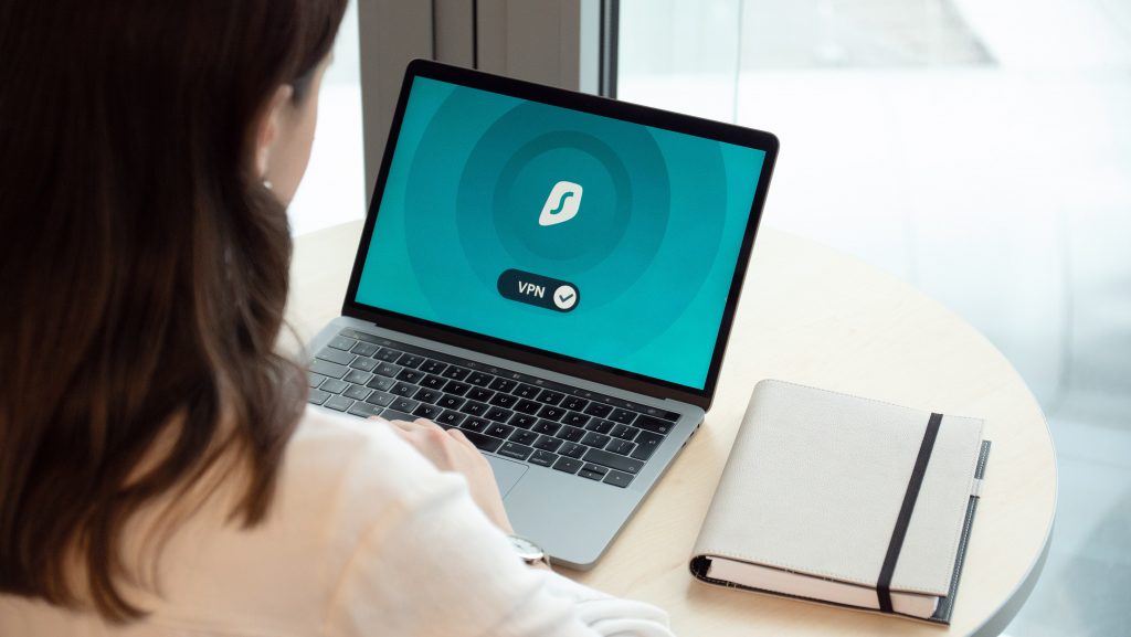 Woman Using Laptop with VPN