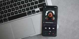 Apple Music on an iPhone sitting on Mac